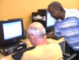 Greg assisting a student with Microsoft Word
