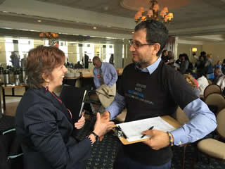 Former Academy student Patricia Collins-Spina getting down to business with Comcast Representative