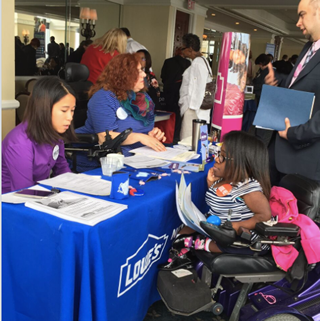 Lowes Home Improvement Representative Lisa Langanin and Wendy Elliott-Vandivier discussing job opportunities with OVR consumers